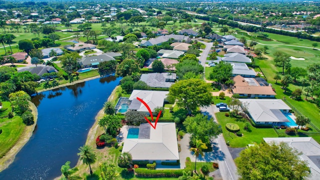 drone / aerial view with a residential view and a water view