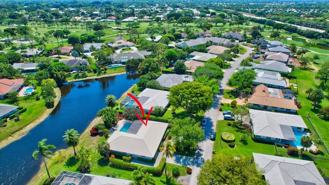 bird's eye view featuring a residential view and a water view