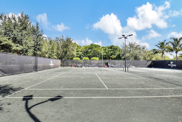 view of sport court with fence