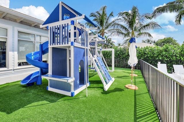 view of play area with a yard and fence