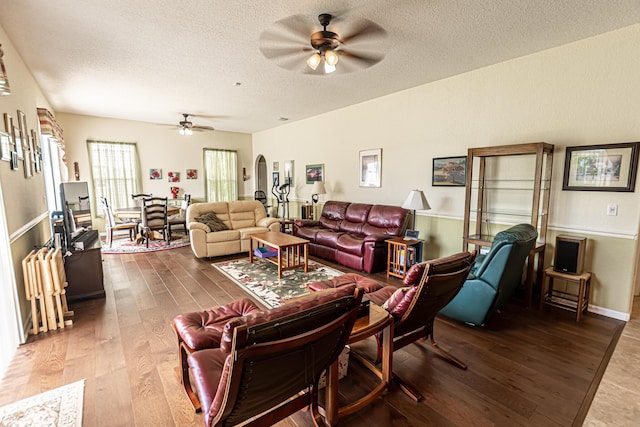 6496 NW Groveland Ter, Port Saint Lucie, FL 34986 - living area featuring wood finished floors, a textured ceiling, and ceiling fan