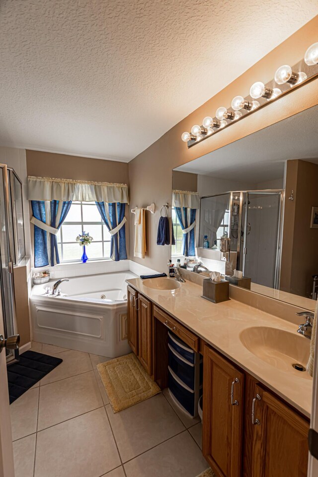 6496 NW Groveland Ter, Port Saint Lucie, FL 34986 - bathroom with tile patterned flooring, double vanity, a stall shower, and a sink
