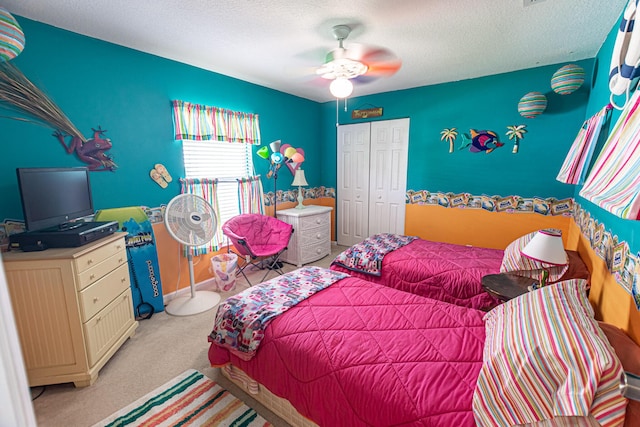 6496 NW Groveland Ter, Port Saint Lucie, FL 34986 - bedroom featuring a closet, a textured ceiling, ceiling fan, and carpet
