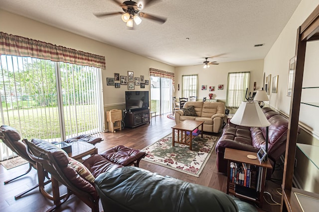 6496 NW Groveland Ter, Port Saint Lucie, FL 34986 - living area featuring plenty of natural light, a textured ceiling, ceiling fan, and wood finished floors