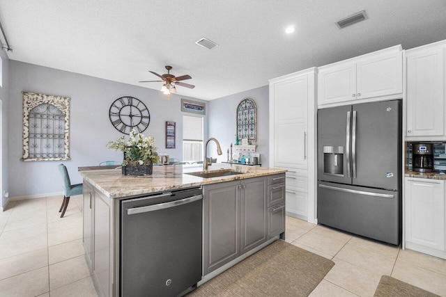 6346 Sand Hills Cir, Lake Worth, FL 33463 - kitchen with a sink, appliances with stainless steel finishes, light tile patterned flooring, and visible vents