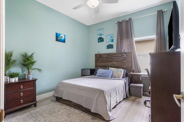6346 Sand Hills Cir, Lake Worth, FL 33463 - bedroom with baseboards, light wood-style flooring, and a ceiling fan