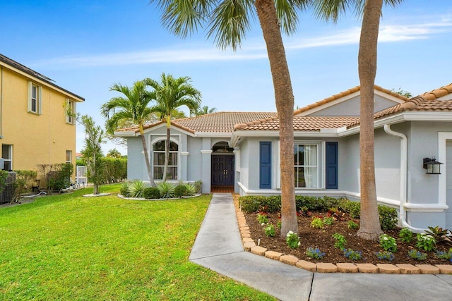 6346 Sand Hills Cir, Lake Worth, FL 33463 - view of front of home with a tiled roof, a front yard, and stucco siding