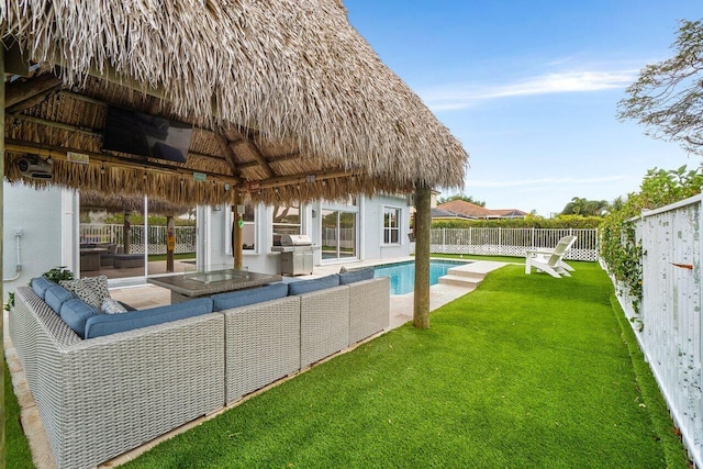 6346 Sand Hills Cir, Lake Worth, FL 33463 - view of swimming pool featuring a fenced backyard, area for grilling, an outdoor living space, and a lawn
