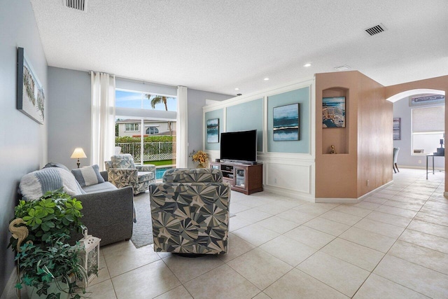 6346 Sand Hills Cir, Lake Worth, FL 33463 - tiled living area with recessed lighting, arched walkways, a textured ceiling, and visible vents