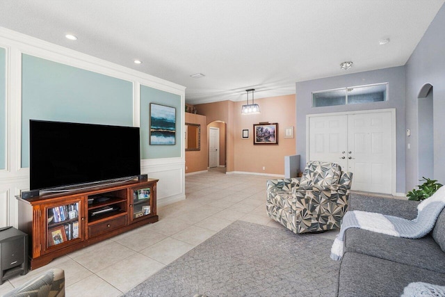 6346 Sand Hills Cir, Lake Worth, FL 33463 - living area with light tile patterned flooring, recessed lighting, arched walkways, and a decorative wall