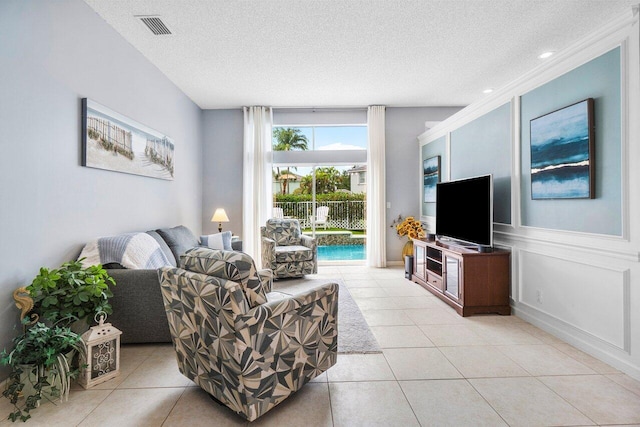6346 Sand Hills Cir, Lake Worth, FL 33463 - living room featuring tile patterned floors, visible vents, and a textured ceiling