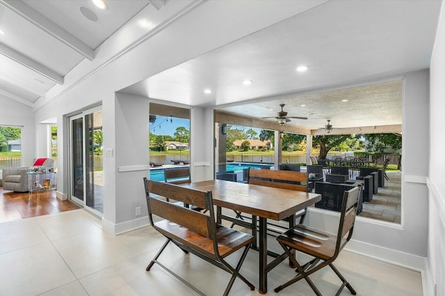 dining space featuring lofted ceiling with beams, baseboards, and recessed lighting