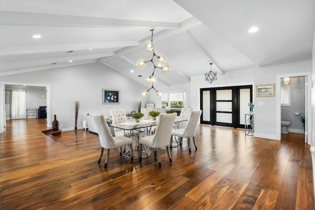 dining area featuring a notable chandelier, vaulted ceiling with beams, baseboards, and wood finished floors
