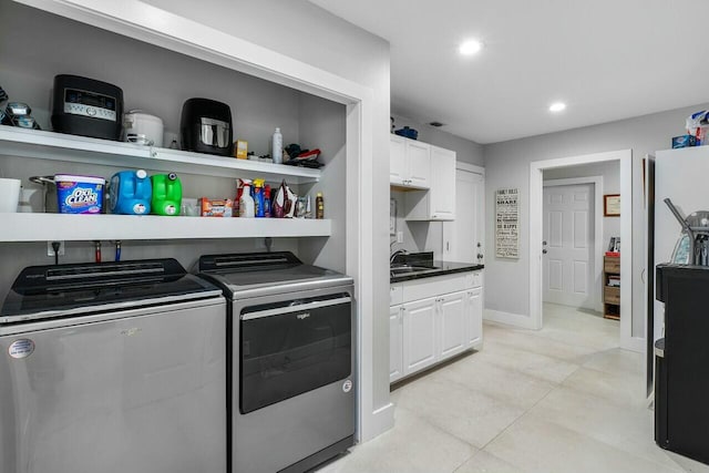 laundry area featuring laundry area, recessed lighting, a sink, washing machine and dryer, and light tile patterned floors