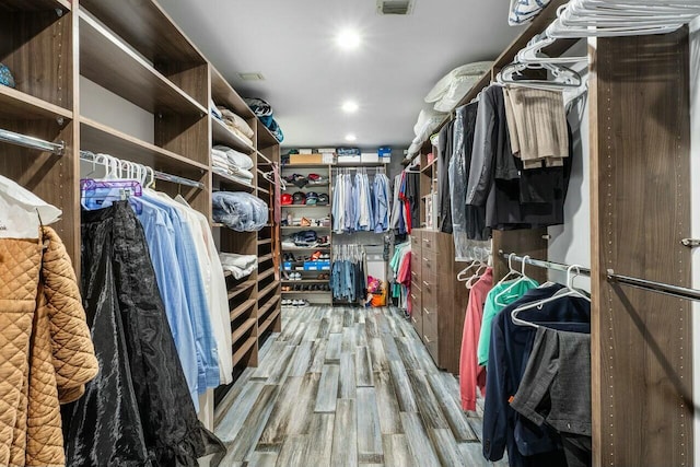spacious closet featuring wood finished floors