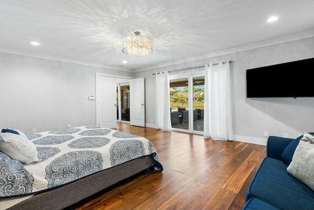 bedroom with baseboards, crown molding, access to outside, and wood finished floors
