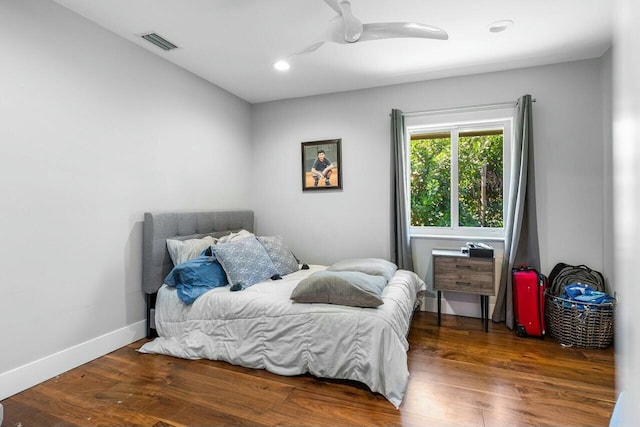 bedroom featuring visible vents, baseboards, wood finished floors, recessed lighting, and a ceiling fan