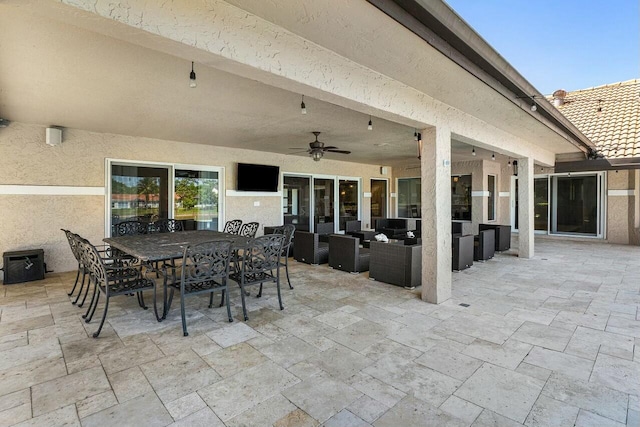 view of patio featuring an outdoor hangout area, outdoor dining area, and a ceiling fan