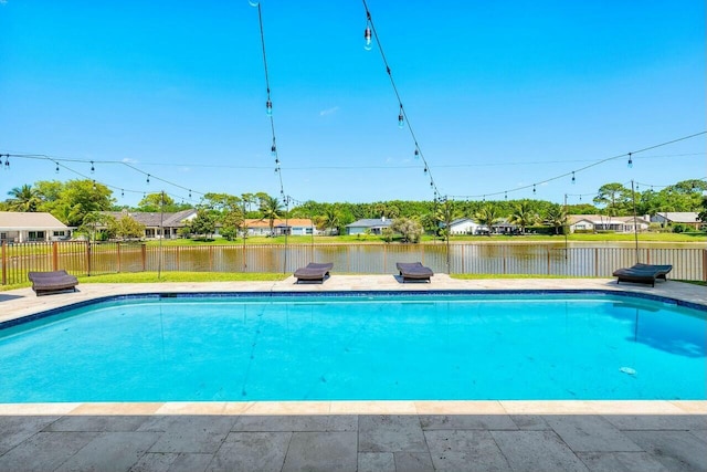 view of pool featuring a water view, fence, and a fenced in pool
