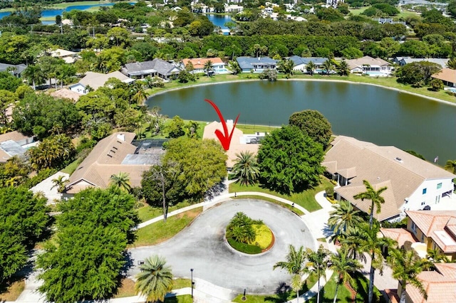 birds eye view of property featuring a water view and a residential view
