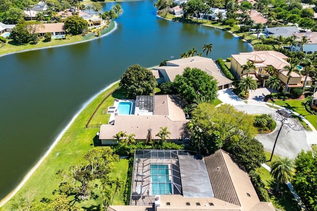 birds eye view of property featuring a water view and a residential view