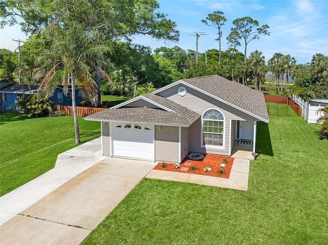 ranch-style home with a shingled roof, a front lawn, fence, concrete driveway, and a garage