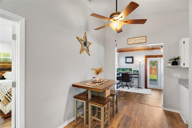 dining area featuring plenty of natural light, baseboards, ceiling fan, and wood finished floors