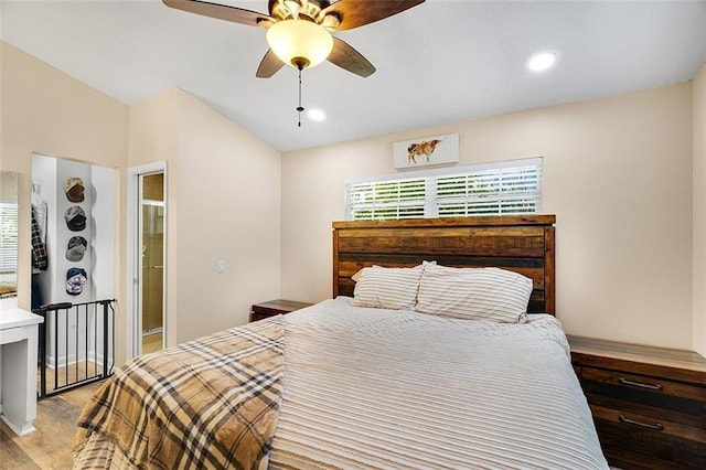 bedroom with a ceiling fan, vaulted ceiling, recessed lighting, and wood finished floors