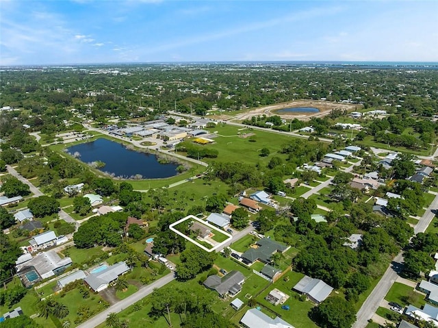 bird's eye view with a residential view and a water view