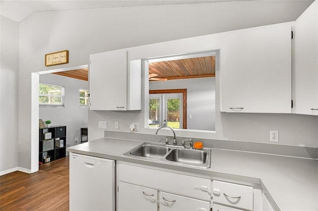 kitchen with a sink, wood finished floors, white cabinetry, white dishwasher, and lofted ceiling