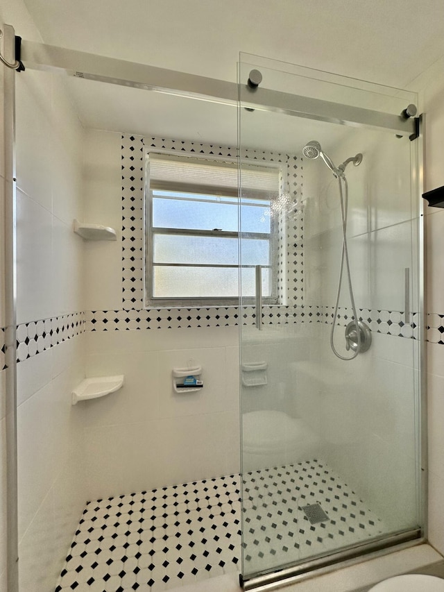 bathroom with a stall shower