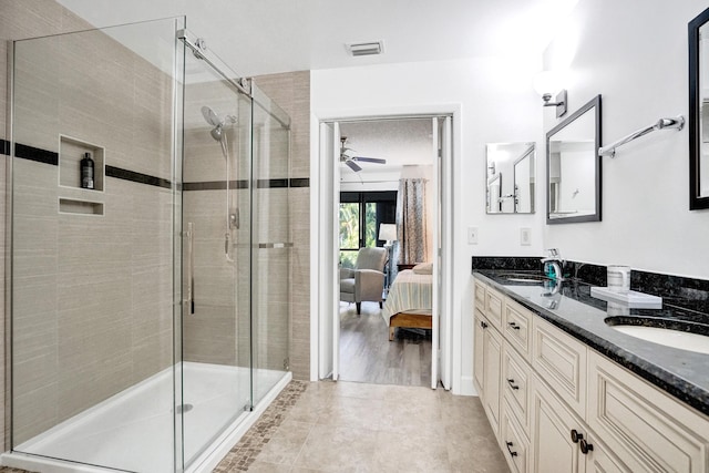 full bath featuring visible vents, ensuite bathroom, a ceiling fan, a sink, and a shower stall