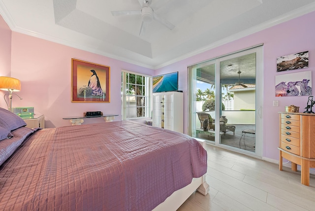 bedroom featuring access to exterior, ceiling fan, ornamental molding, and a raised ceiling