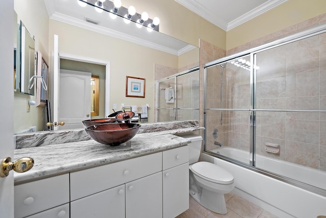 full bath with tile patterned flooring, vanity, ornamental molding, and visible vents
