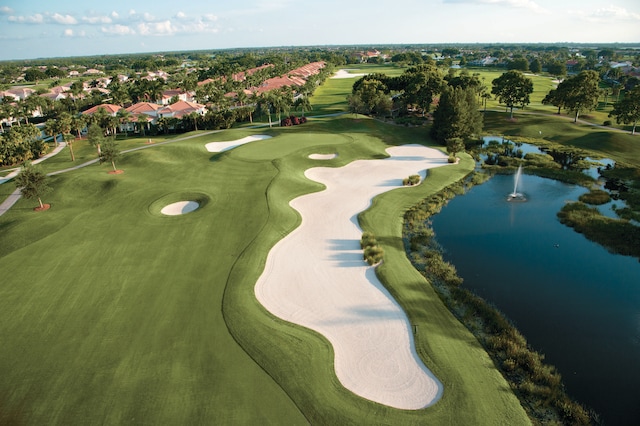 bird's eye view with view of golf course and a water view