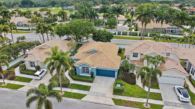 birds eye view of property with a residential view