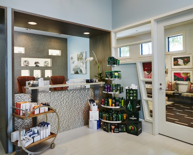 interior space featuring french doors and an accent wall