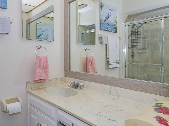 full bath featuring a stall shower and vanity