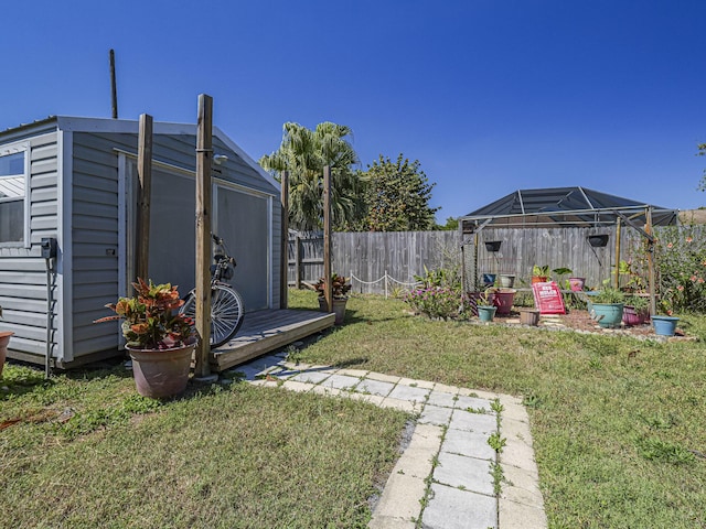 view of yard with an outbuilding and a fenced backyard