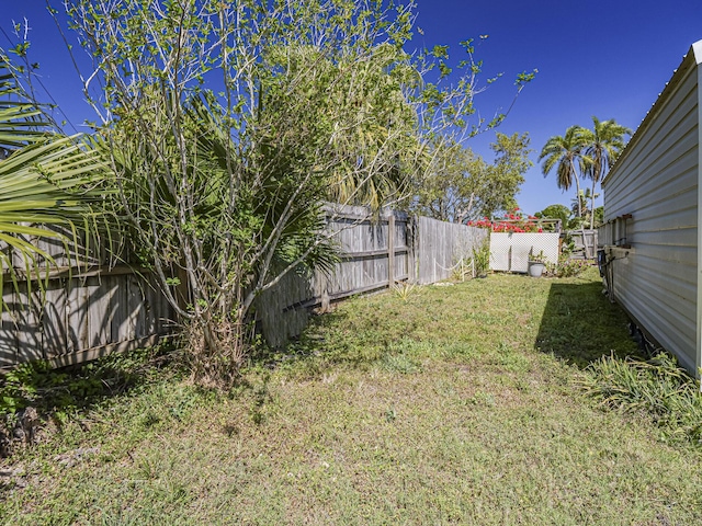 view of yard with a fenced backyard