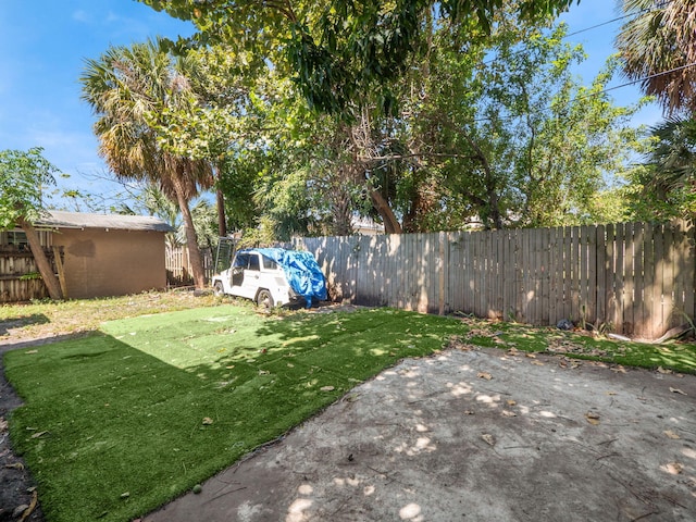 view of yard featuring a patio and a fenced backyard