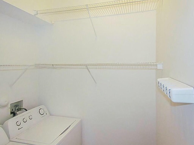 washroom with washer / dryer and laundry area