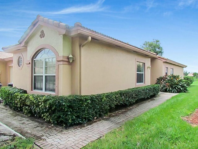 view of home's exterior with stucco siding