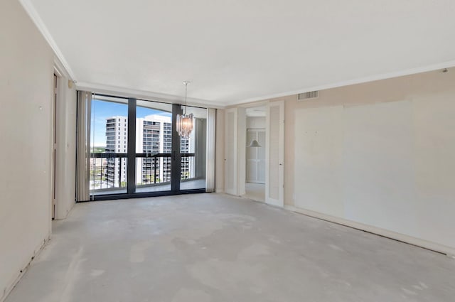 4545 N Ocean Blvd Unit 10C, Boca Raton, FL 33431 - empty room featuring a chandelier, unfinished concrete floors, and a wall of windows