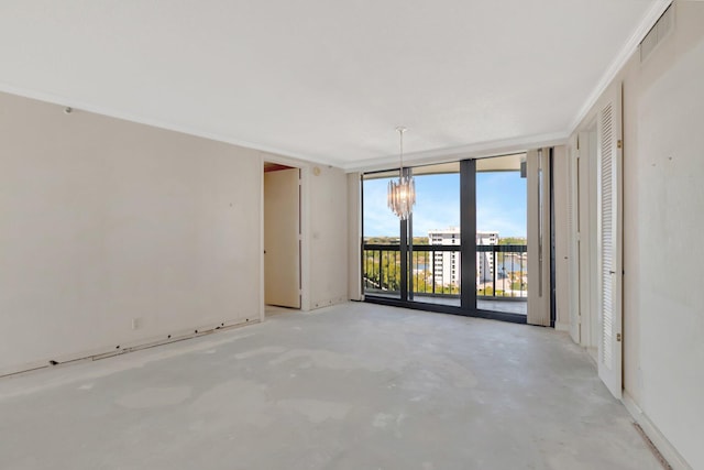 4545 N Ocean Blvd Unit 10C, Boca Raton, FL 33431 - spare room with floor to ceiling windows, a chandelier, and concrete floors