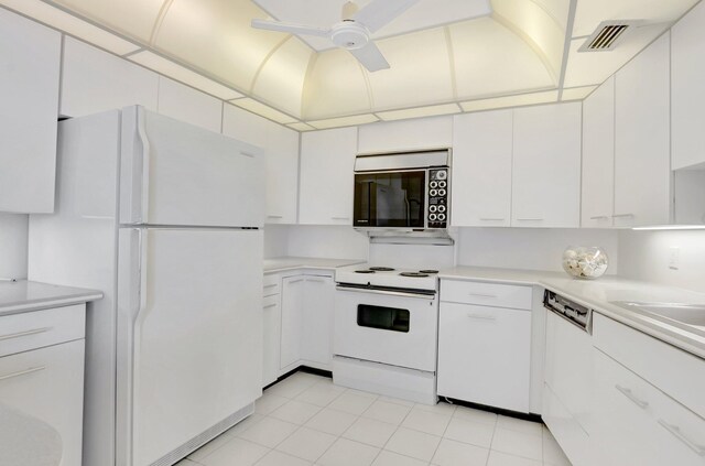 4545 N Ocean Blvd Unit 10C, Boca Raton, FL 33431 - kitchen with white appliances, a ceiling fan, white cabinets, light countertops, and light tile patterned flooring