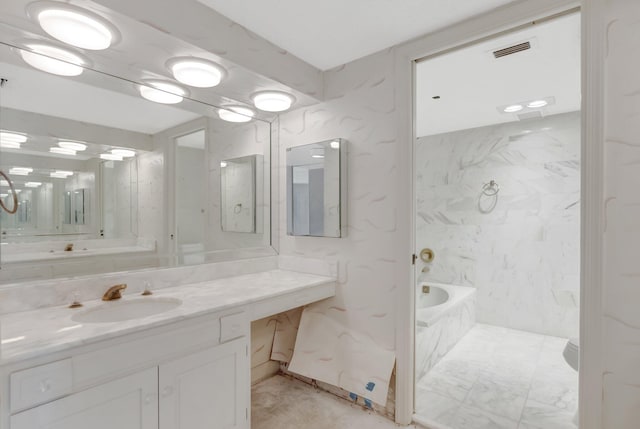 4545 N Ocean Blvd Unit 10C, Boca Raton, FL 33431 - bathroom featuring a tub with marble appearance and vanity