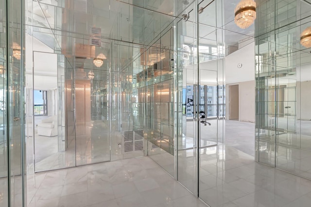 4545 N Ocean Blvd Unit 10C, Boca Raton, FL 33431 - bathroom with a towering ceiling and marble finish flooring
