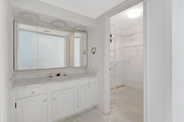 4545 N Ocean Blvd Unit 10C, Boca Raton, FL 33431 - bathroom featuring vanity and a spacious closet