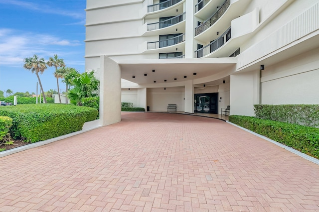 4545 N Ocean Blvd Unit 10C, Boca Raton, FL 33431 - view of home's community featuring decorative driveway and an attached garage
